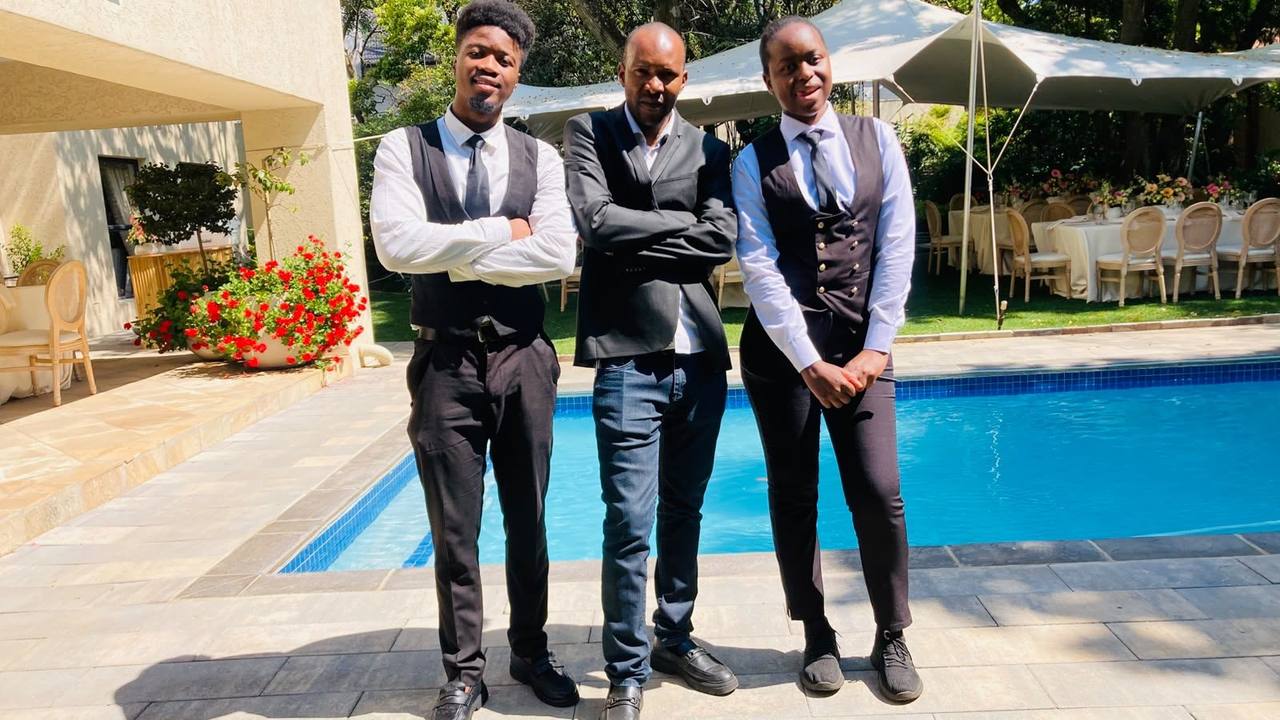 Three professional TM Events staff members at a poolside function in Johannesburg