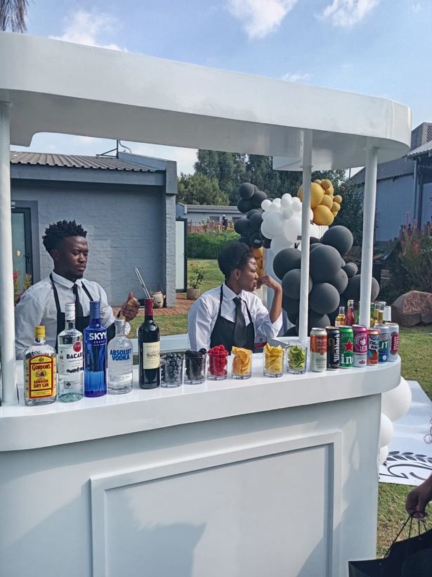 TM Events bartender at a mobile bar setup at a garden event