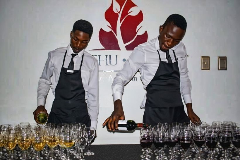 TM Events bar staff pouring wine at an event